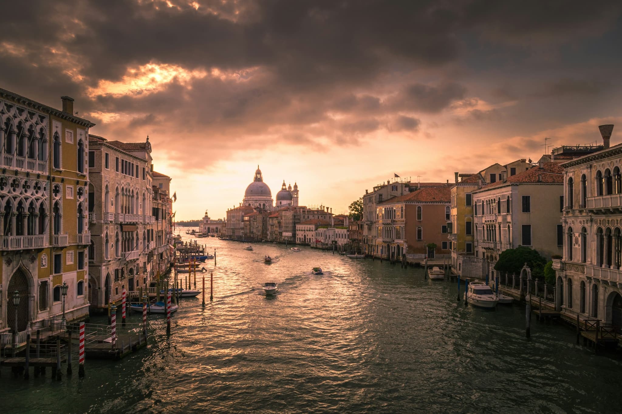 Quiet waterside in Castello near the Arsenale at evening, residential facades on a wide canal.
